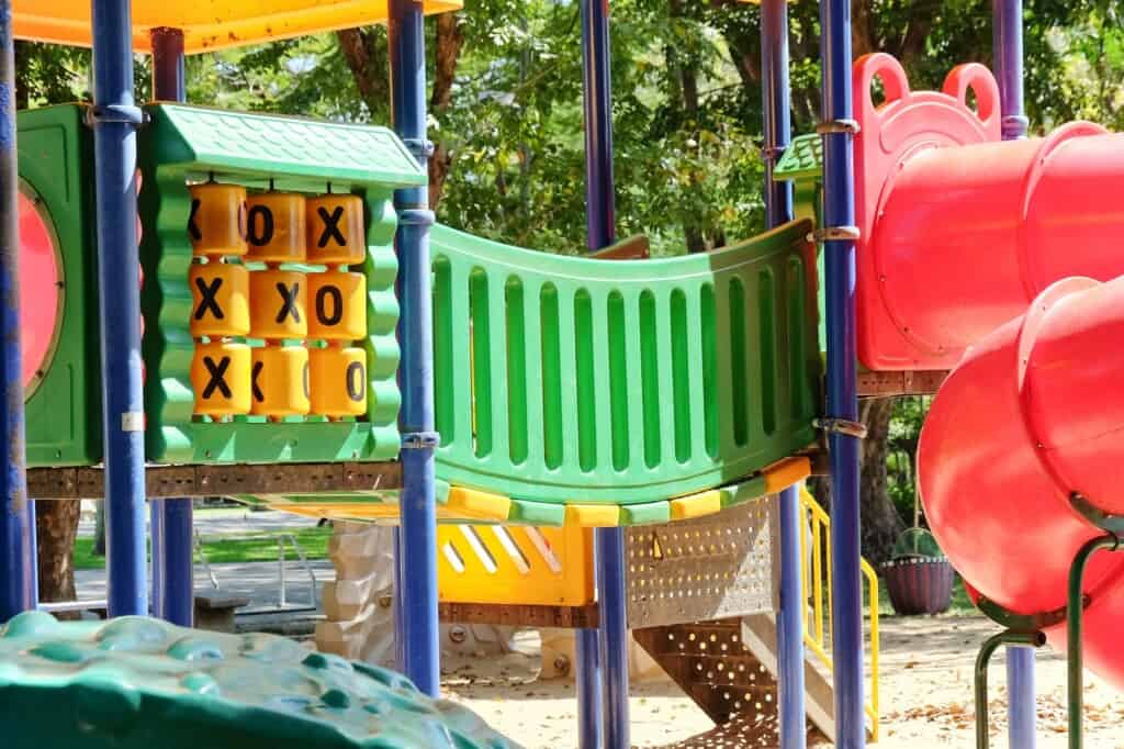 Empty children's playground under the sun