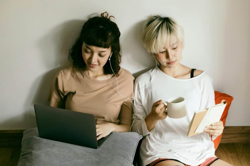 Two female students studying together in their shared flat