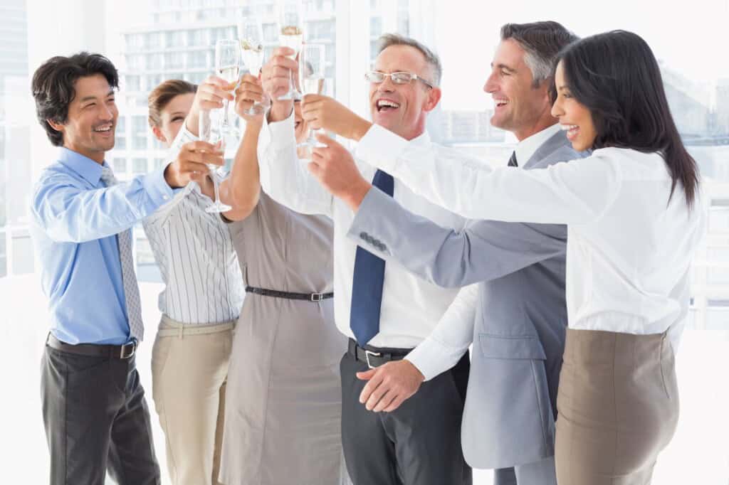 Employees and clients celebrating the office move