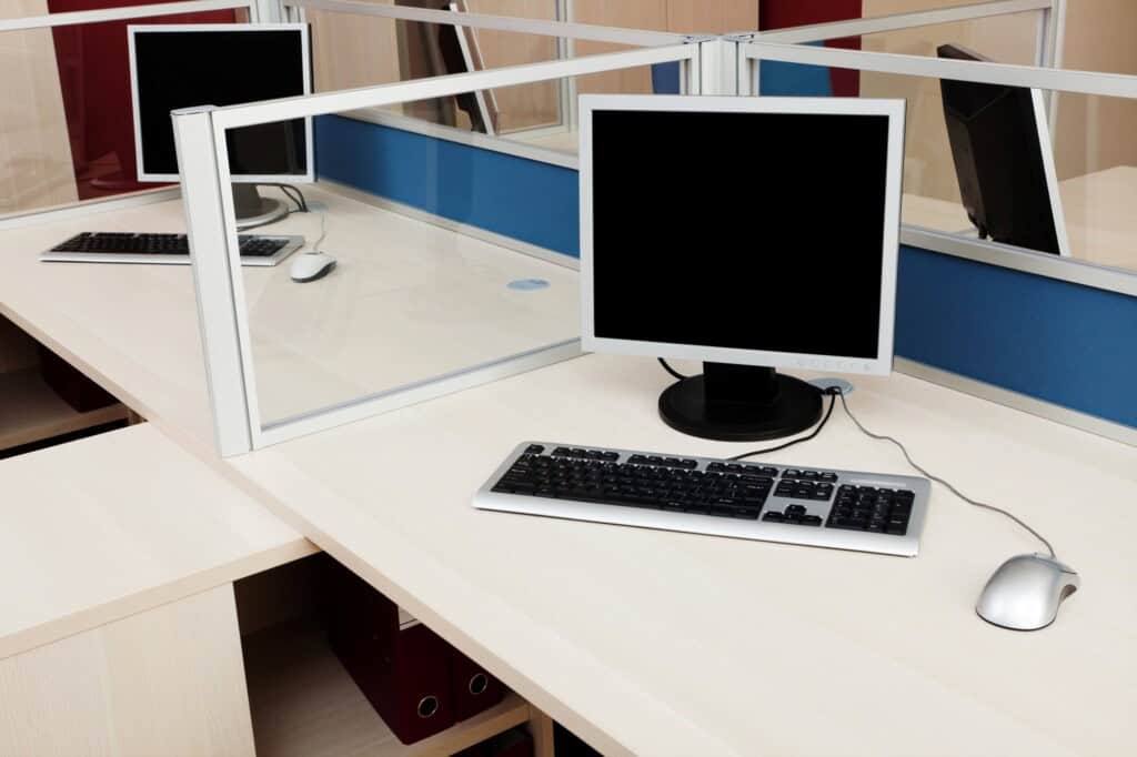 Tidy work desks in an office with computer sets